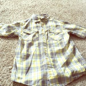 Yellow,white, and black shirt